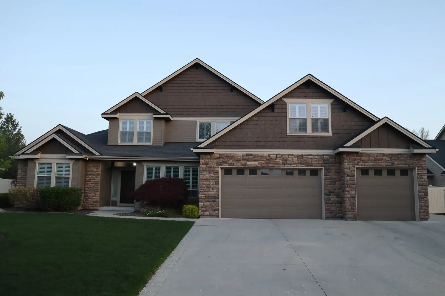 Daytime view of a two-storey home where the permanent lighting track is hidden in the soffit