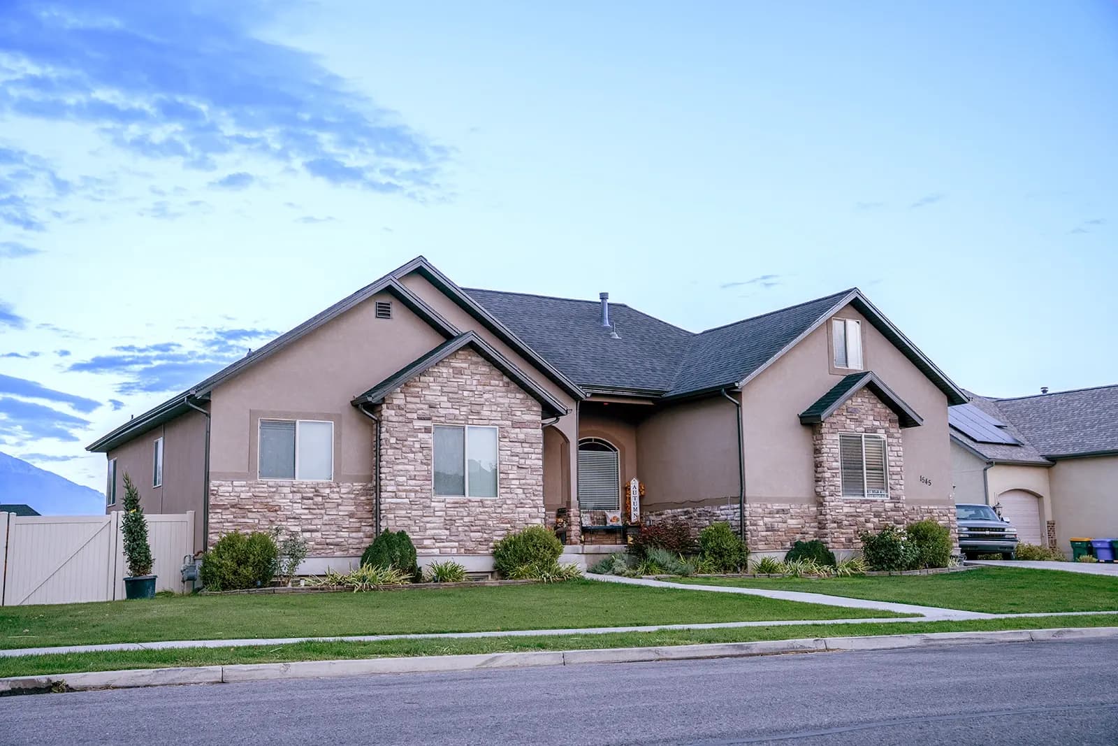 Daytime front elevation of a home showing how discreet the lighting track is