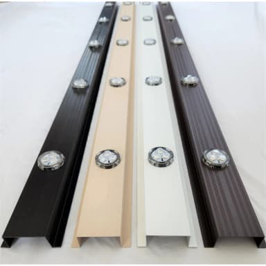 Black, wicker and white aluminum lighting track with pucks